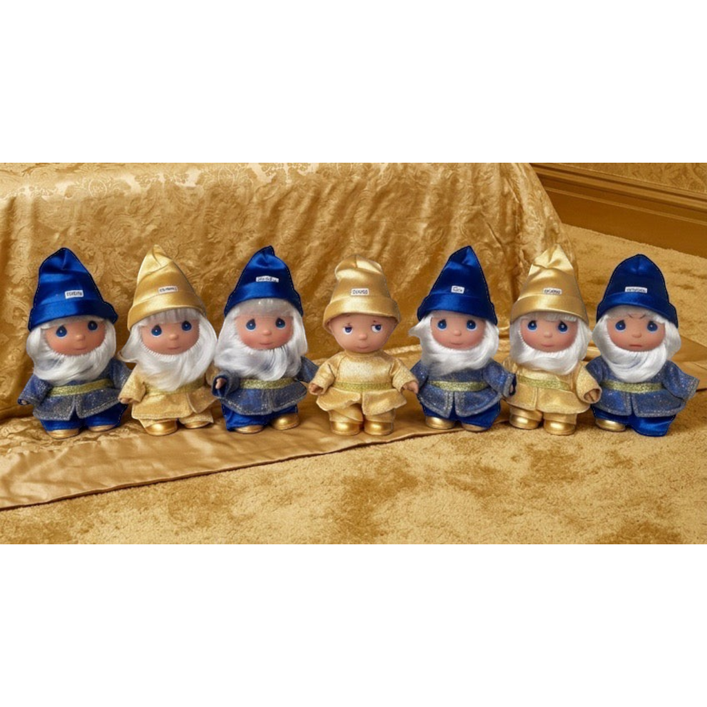 The Doll Maker 50th anniversary Seven Dwarfs doll set in blue and gold outfits with hand-finished details.