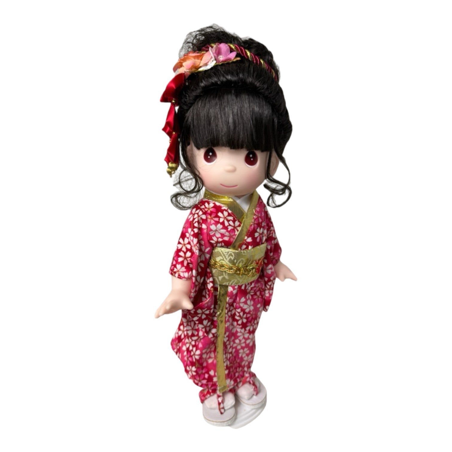 The Doll Maker 12-inch Shinobu doll wearing a red floral kimono with gold obi for Japanese Girls' Day celebration.