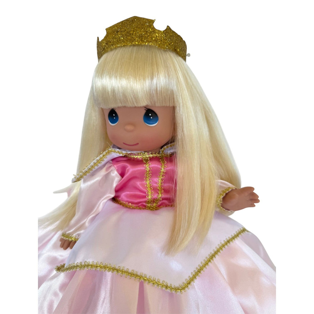The Doll Maker 12-inch Sleeping Beauty doll with blonde hair, blue eyes, gold glitter crown, and pink satin dress.