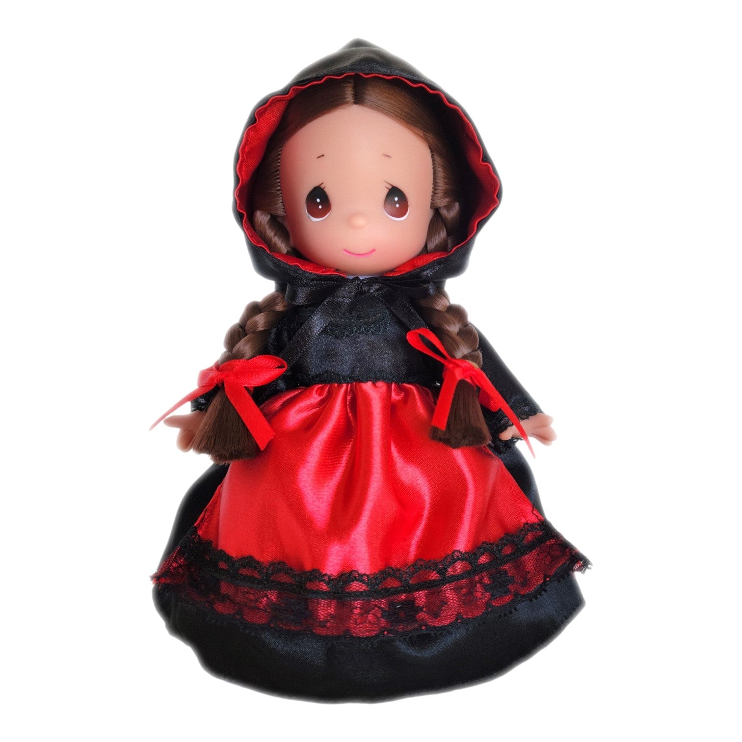 The Doll Maker Sofia 9-inch vinyl doll from Argentina wearing a traditional black and red dress with a hooded cape.