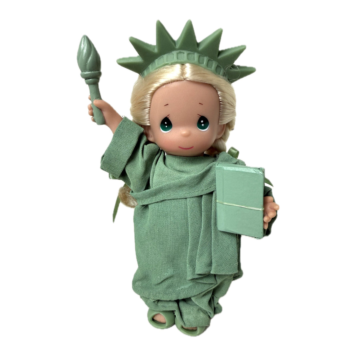 The Doll Maker 7-inch Statue of Liberty vinyl doll with iconic green robes, crown, torch, and tablet.