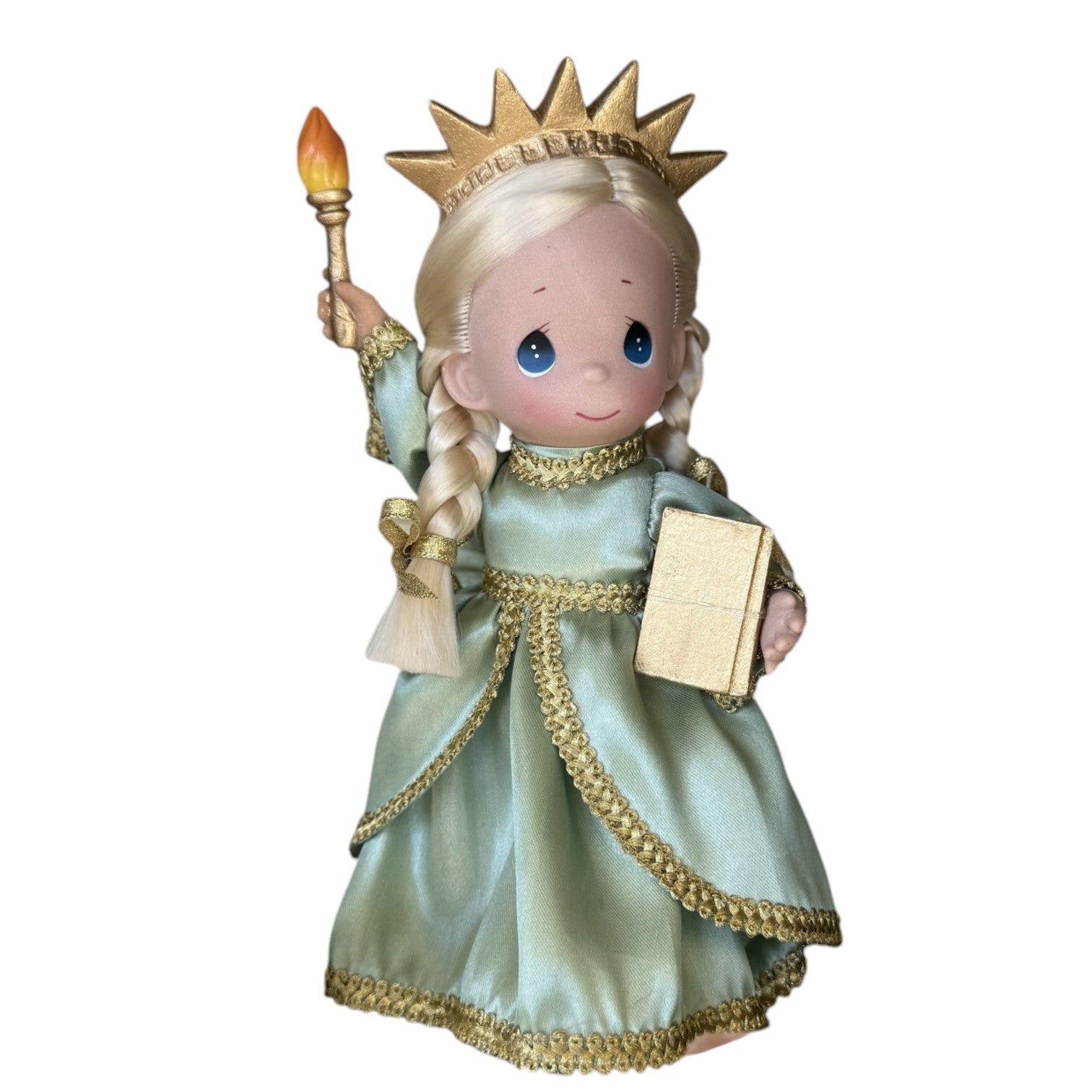 The Doll Maker 9-inch Statue of Liberty doll in a green dress with a gold crown, torch, and book for USA anniversary.