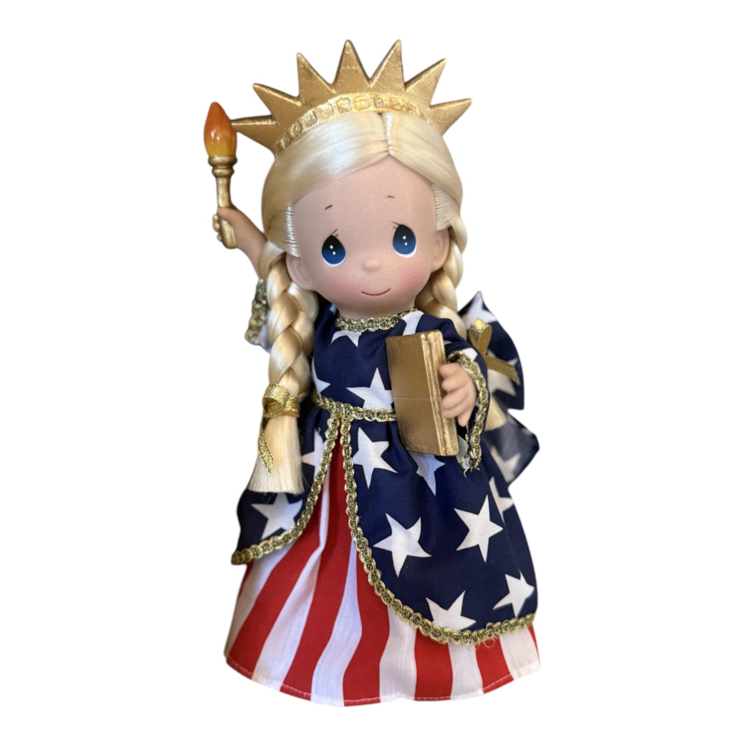 The Doll Maker 9-inch Statue of Liberty doll in a patriotic red, white, and blue star-spangled dress with gold crown.