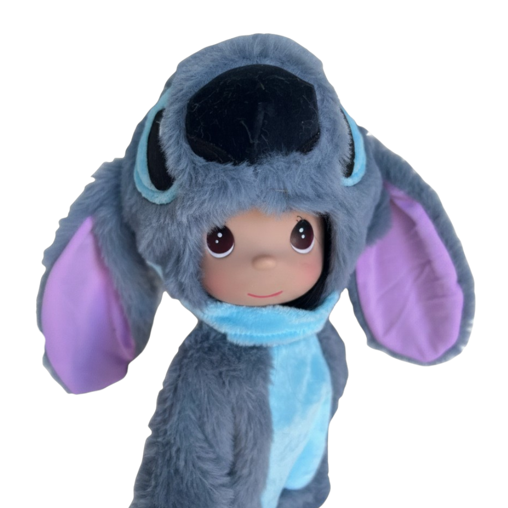 The Doll Maker 12-inch Stitch vinyl doll wearing a soft grey and blue plush costume with large purple-lined ears