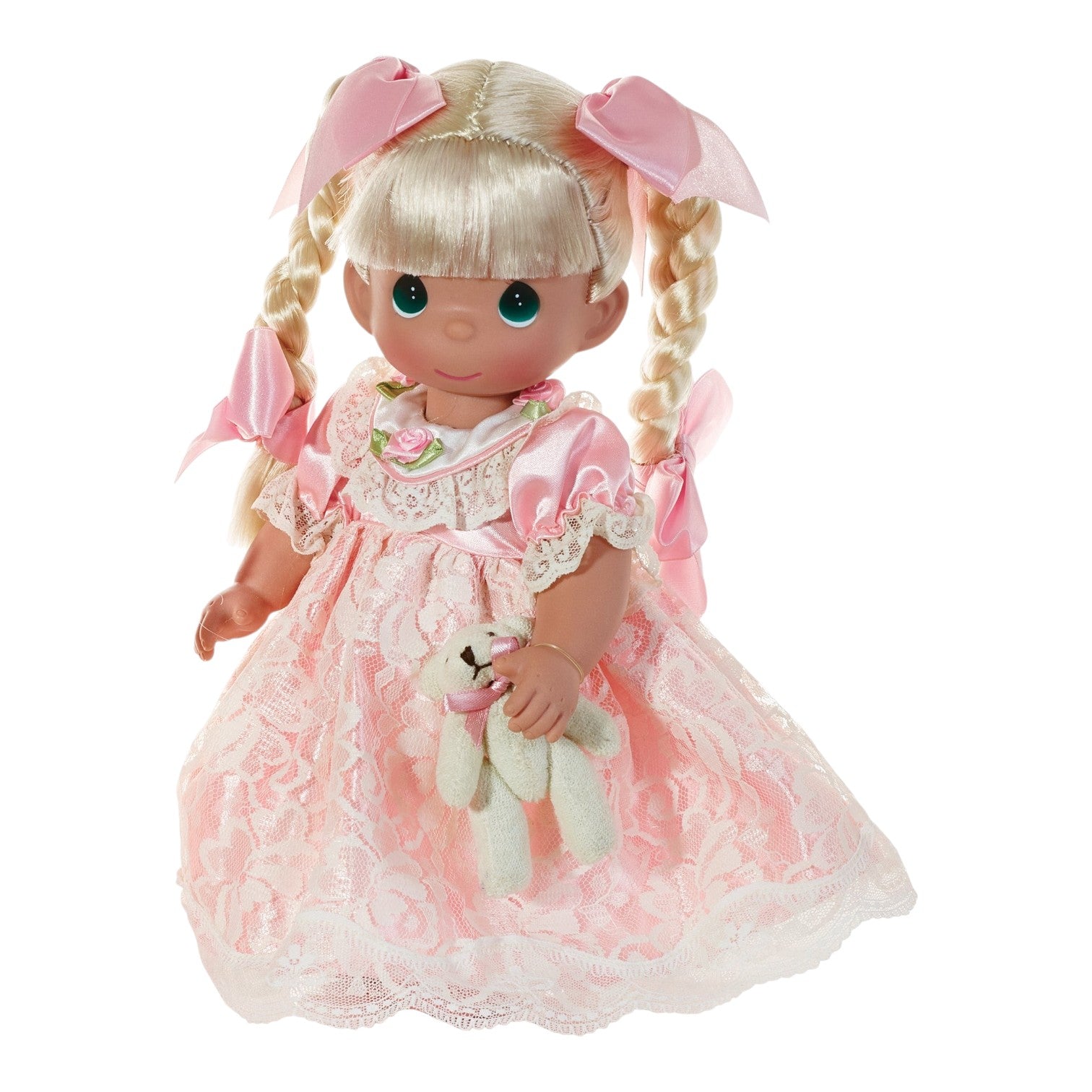 The Doll Maker 12-inch Sugar blonde doll wearing a pink lace dress with bows, holding a small teddy bear.