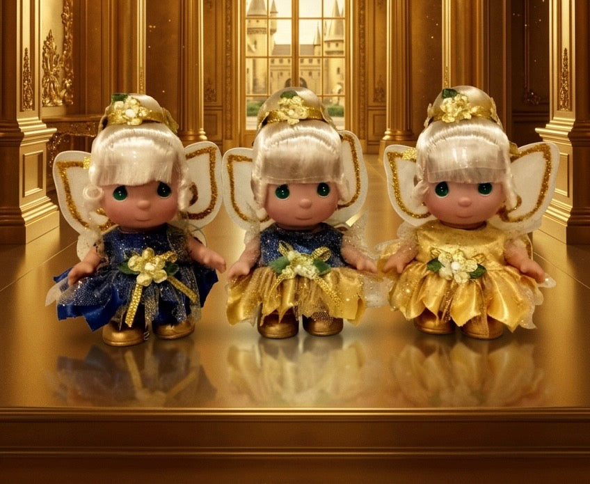 The Doll Maker 50th Anniversary mini Tinker Bell doll set featuring three 5-inch dolls in blue and gold outfits.
