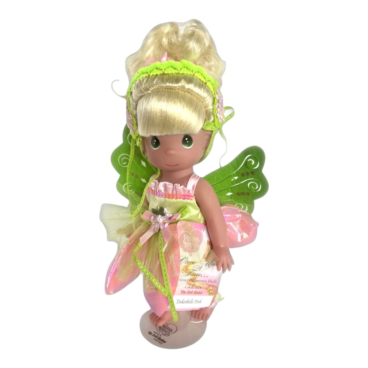 The Doll Maker 12-inch Tinker Bell collectible doll wearing a pink and green fairy outfit with shimmering wings.