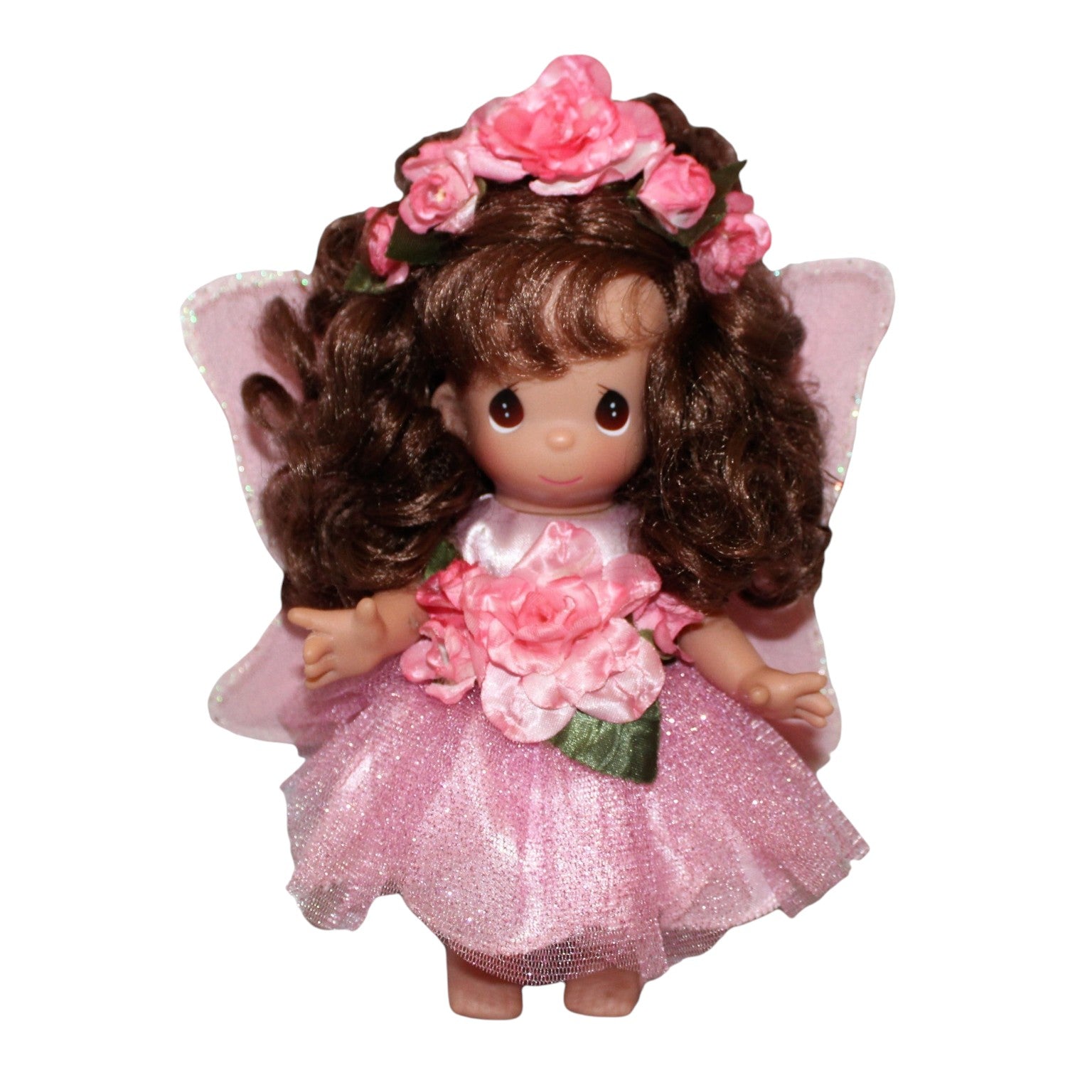 The Doll Maker Woodland Fairy Willow 9-inch vinyl doll in a pink glittery dress with floral crown and fairy wings.