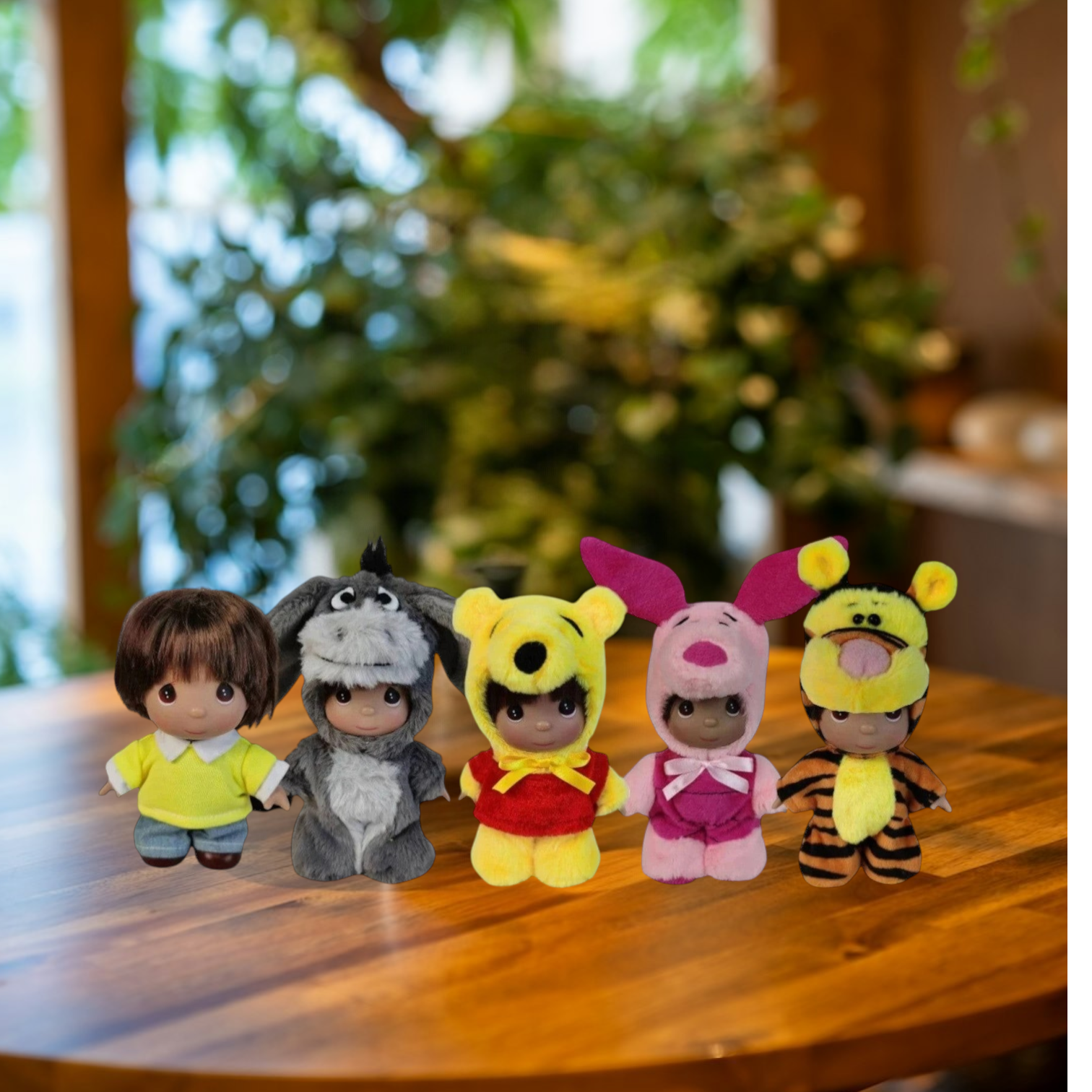 The Doll Maker Winnie the Pooh set of five 5-inch collectible dolls featuring character costumes on a wooden table.