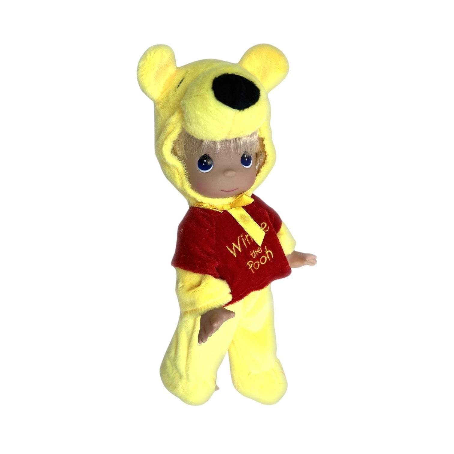 The Doll Maker 12-inch Winnie the Pooh plush doll wearing a yellow bear hood and red shirt with embroidered text.
