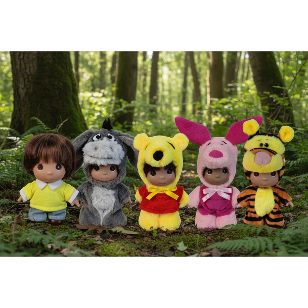 The Doll Maker Winnie the Pooh set featuring five 5-inch collectible dolls dressed in character costumes in a forest.
