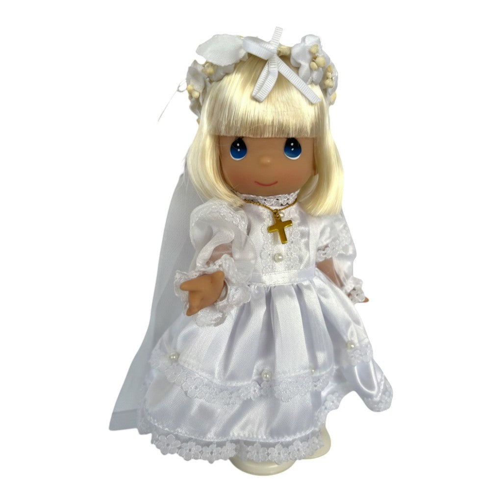 The Doll Maker blonde communion doll in white satin gown, veil, and gold cross necklace.