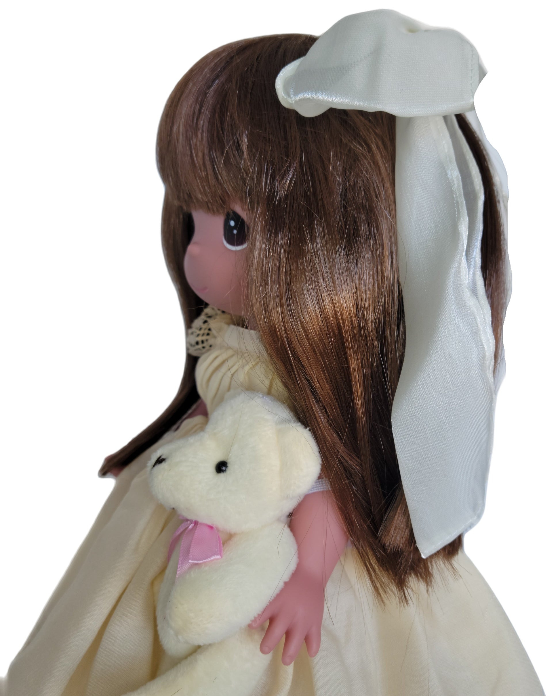 The Doll Maker's Cherish Me Always Auburn doll in ivory lace gown holding a teddy bear.