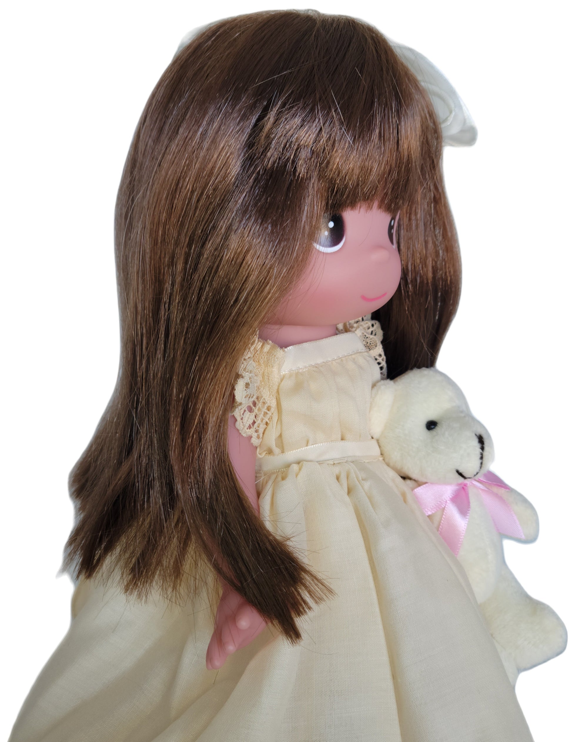The Doll Maker Cherish Me Always Auburn doll with brown hair, wearing an ivory lace gown and holding a teddy bear.