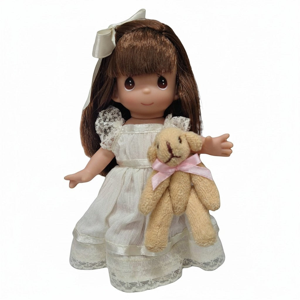 The Doll Maker Cherish Me Always brunette doll in ivory lace gown holding a teddy bear.